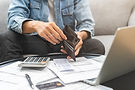 Hands pulling money out of wallet